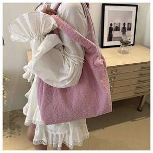 Detailed macro view of the soft pink pleated bubble texture on this large tote bag