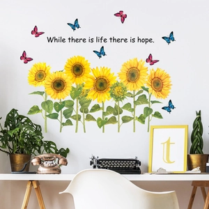 Detail of sunflower wall sticker with butterfly and While there is life there is hope quote