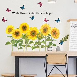 Sunflower and butterfly wall stickers with inspirational quote in cozy home setting