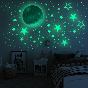 Luminous wall stickers set featuring a large moon and glowing stars for kids room