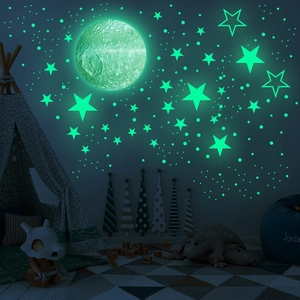 Luminous moon and star wall stickers creating a realistic glowing galaxy for kids rooms