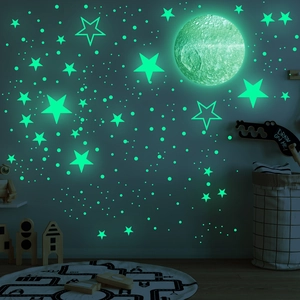 Detailed view of glow in the dark moon and star wall stickers set for kids room