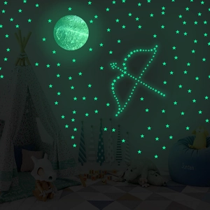Glow in the dark moon and stars wall decals in kids bedroom with luminous green effect
