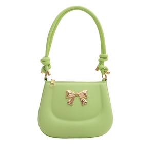 Chic light green leather handbag with golden bow detail and knotted handle on white background