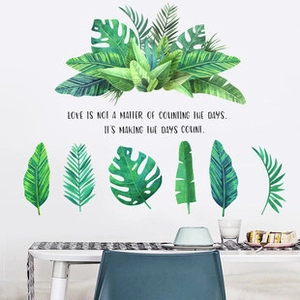 Green tropical leaf wall stickers featuring monstera and palm leaves for dining room decor