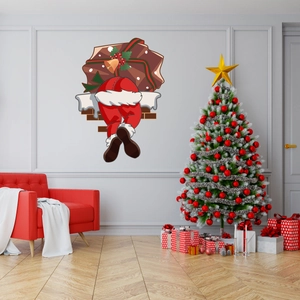 Detail of Christmas wall sticker showing Santa's legs and gift bag in a cozy living room