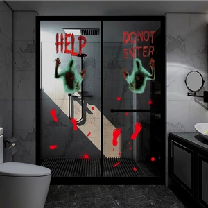 Bloody handprints and HELP text Halloween wall stickers on a bathroom glass door