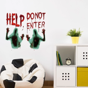 Green zombie silhouettes and red blood-effect HELP wall stickers on a white interior wall