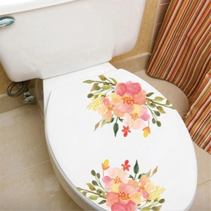 Detail of floral toilet seat decals with watercolor pink flowers and green leaves