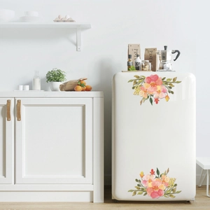 Detail of watercolor floral wall decals on a white fridge in a modern kitchen