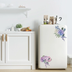 Macro detail of watercolor hydrangea floral decals applied to a creamy white refrigerator side