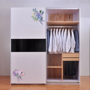 Detail of sliding wardrobe doors with blue and purple hydrangea floral wall decals