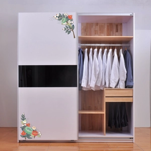 Detail of floral corner stickers and black stripe design on a modern white sliding wardrobe