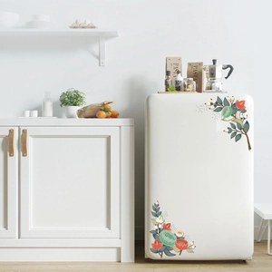 Detail of floral Christmas wall stickers applied on a white refrigerator surface
