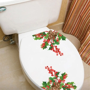 Christmas toilet lid decal featuring red berries, green holly leaves and pine cones