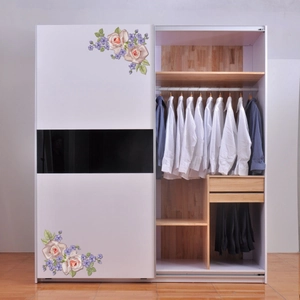 Detailed interior view of a large floral wardrobe with hanging areas and drawers