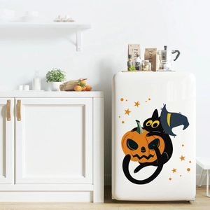 Detail of Halloween cat and pumpkin stickers on a minimalist white kitchen fridge