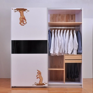 3D realistic zombie hand Halloween stickers applied on a smooth white wardrobe door surface