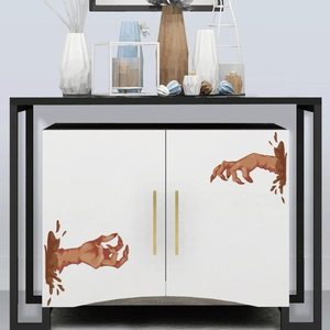 Creepy monster hands wall stickers applied to white cabinet doors for Halloween decor