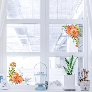 Close-up of colorful floral window stickers on glass for home Christmas decoration