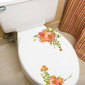 Detailed watercolor floral stickers with orange and yellow flowers on a white toilet lid