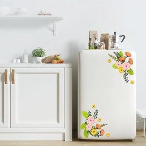 Macro view of floral wall decals featuring pink and yellow flowers on a white refrigerator