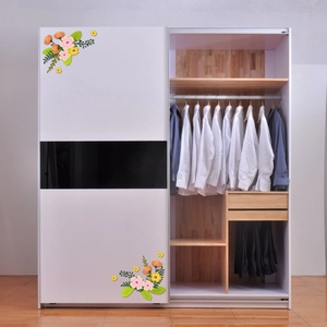 Floral wall decal with pink and yellow flowers applied to a modern white wardrobe panel