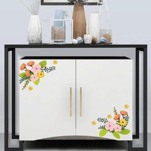 Self-adhesive floral stickers with pink and orange flowers on a white cabinet