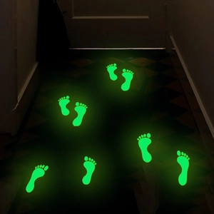 Adesivi murali luminosi con impronte di piedi per camerette bambini in verde fluo