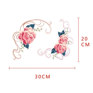 Detail of floral wall sticker with pink roses, blue leaves and gold vine patterns