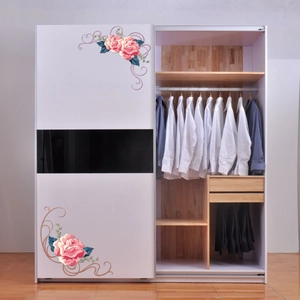 Internal view of a large white sliding door wardrobe showing spacious storage compartments