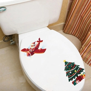 Christmas toilet sticker set featuring Santa in an airplane and a decorated xmas tree