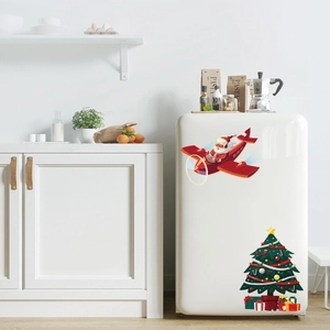 Macro detail of Christmas tree and Santa on plane stickers for fridge decoration