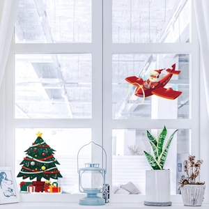 Close-up of Santa in a red plane and Christmas tree electrostatic window stickers