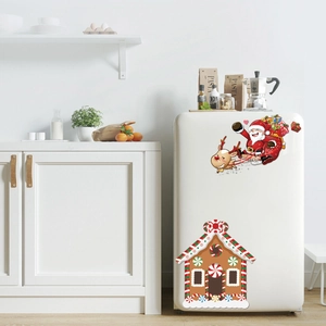Christmas fridge stickers featuring Santa in a reindeer sleigh and festive gingerbread house