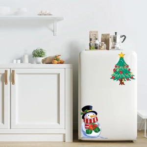 Detailed Christmas stickers featuring a green Xmas tree and snowman on white fridge