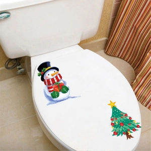 Christmas toilet seat stickers featuring a cute snowman and a green decorated festive tree
