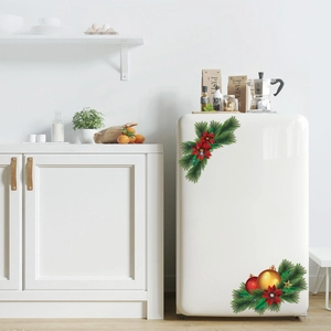 Christmas floral decals with red flowers and pine branches on a white refrigerator