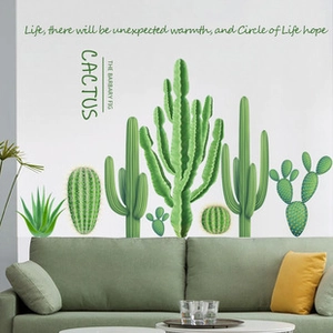 Detail showing cactus wall stickers with watercolor green succulents on a grey wall