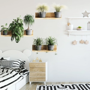 Minimalist wooden wall shelves with faux green plants in a modern bedroom setting