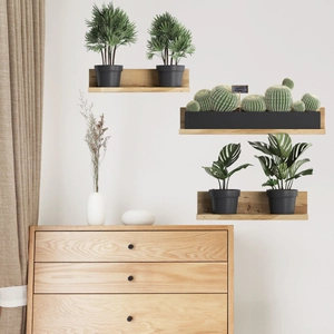 Floating wood shelves set with faux succulents and green plants for wall decor