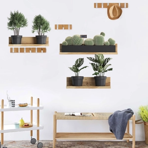 Close-up of wall-mounted wooden shelves and hooks with natural grain on a white wall
