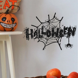 Adesivi murali Halloween con ragnatele e ragni neri appesi su una parete grigia