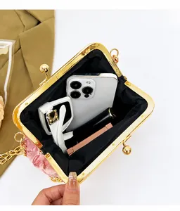 Internal view of pink satin heart evening bag showing space for phone and makeup