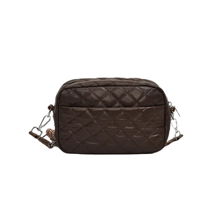 Deep brown quilted crossbody bag with vintage geometric wide strap and silver hardware