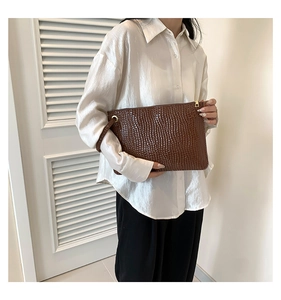 Brown crocodile pattern faux leather envelope clutch bag with metal zipper and wrist strap