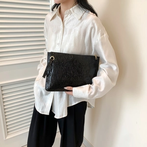 Chic black crocodile pattern envelope clutch bag with gold zipper and wrist strap