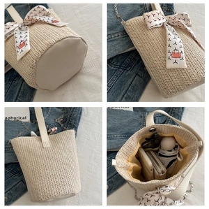 Internal capacity of beige woven tote showing storage for umbrella, wallet and phone