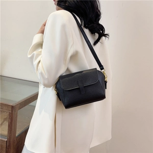 Classic black litchi pattern crossbody bag for women with golden hardware and flap