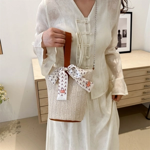 Minimalist large capacity woven tote bag with brown leather handles and silk scarf